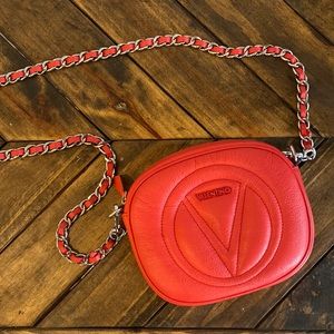 Valentino clutch with detachable red chain